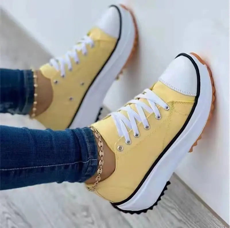 Women's white canvas platform sneakers with thick cushioned sole, casual chic everyday style