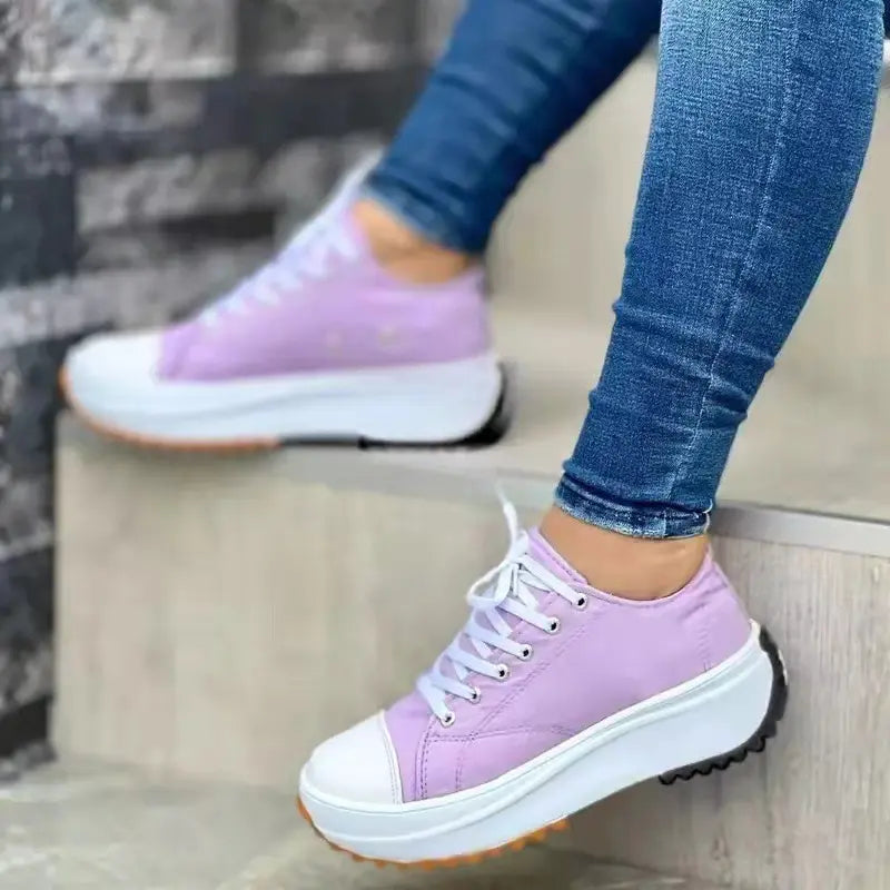 Women's white canvas platform sneakers with thick cushioned sole, casual chic everyday style