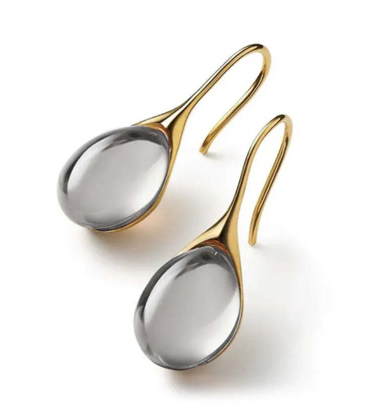 Denise gold-plated teardrop earrings with amber resin centerpiece, lightweight minimalist design