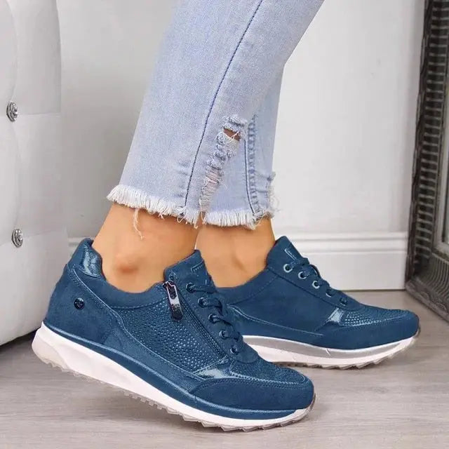Women's casual lace-up sneakers in neutral tones, sleek low-top silhouette with convenient side zipper