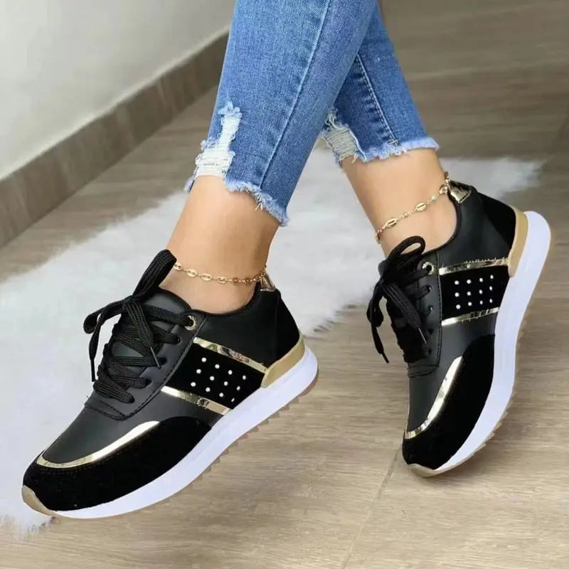 Women's white casual sneakers with sleek low-top silhouette and cushioned supportive insole for all-day comfort
