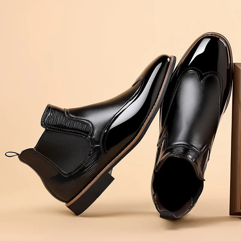 Black high-gloss leather Chelsea boots with elastic side panels and mirror-shine finish