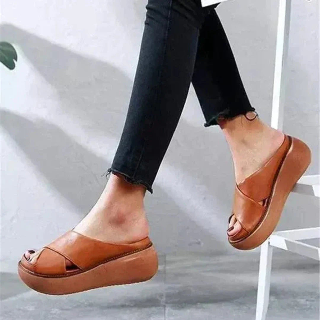 Women's beige cross-strap platform sandals with open-toe silhouette and chunky lightweight sole