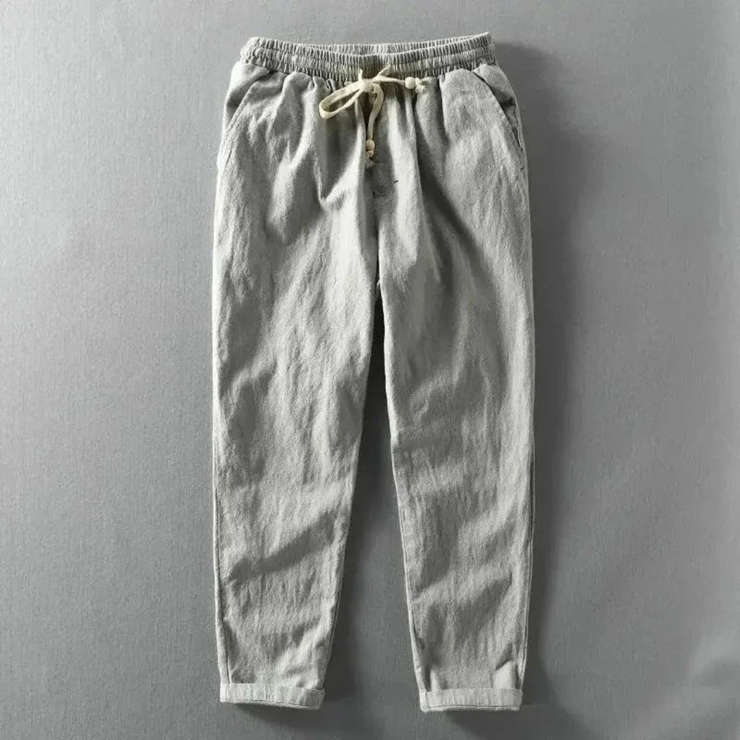 Beige tapered casual joggers with drawstring waistband and foldable hems for relaxed everyday wear