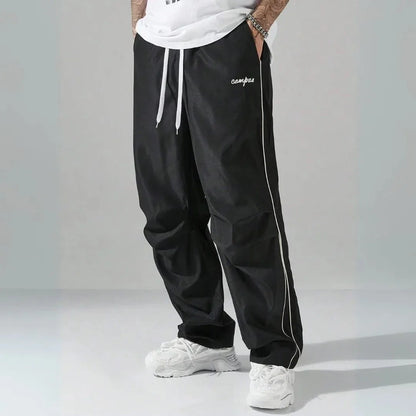 Charlie relaxed-fit track pants with contrast side piping and embroidered campus logo for streetwear