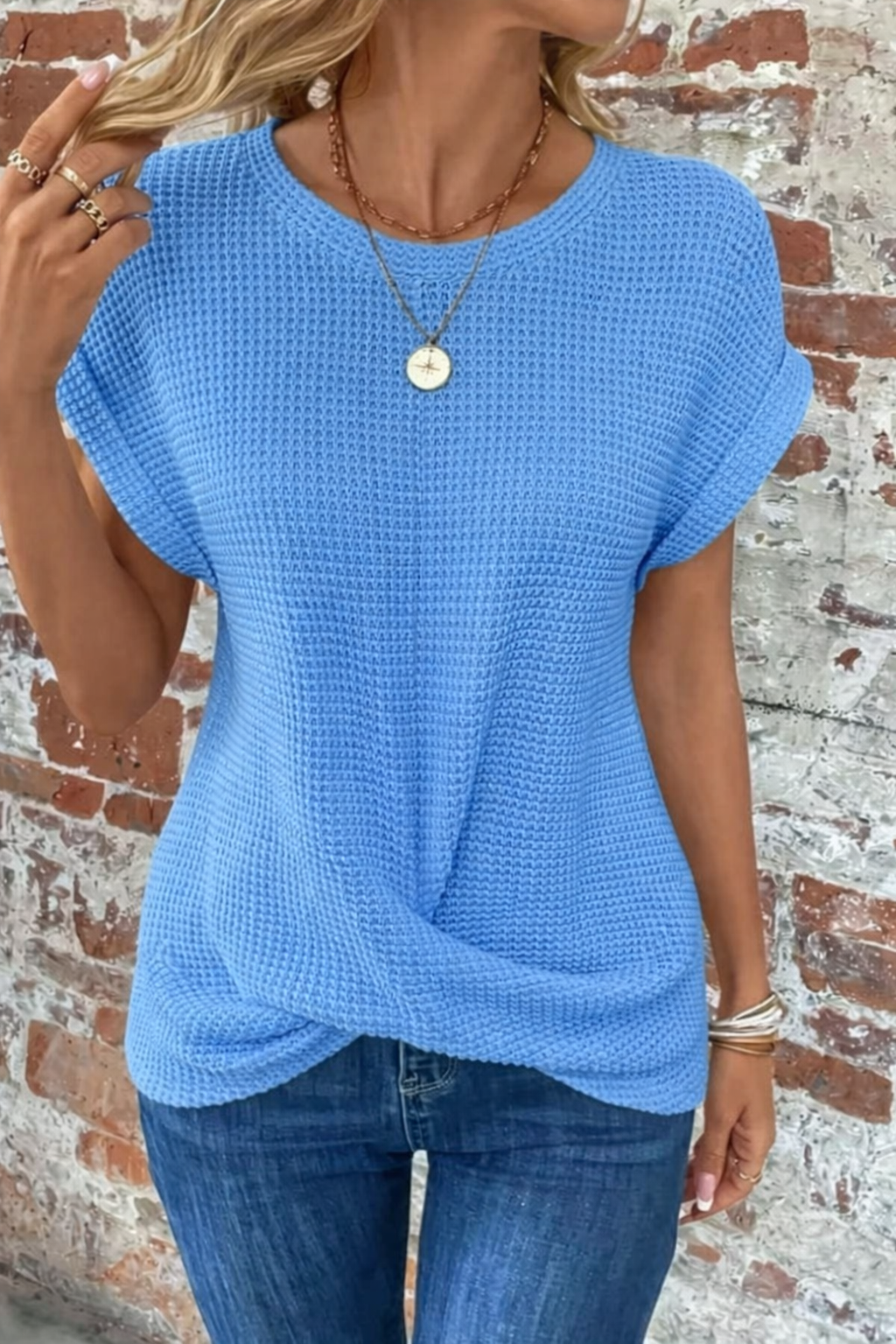 Women's white waffle knit casual tee with rolled sleeves and front twist detail
