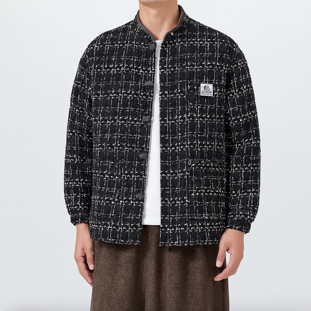 Black tweed boxy jacket with East Asian-inspired pankou knot closure and bold textured design