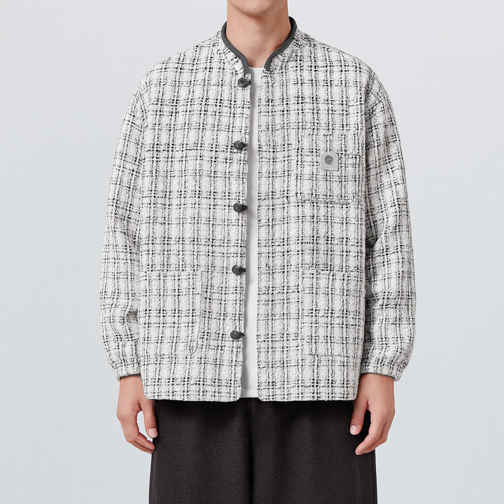 Black tweed boxy jacket with East Asian-inspired pankou knot closure and bold textured design
