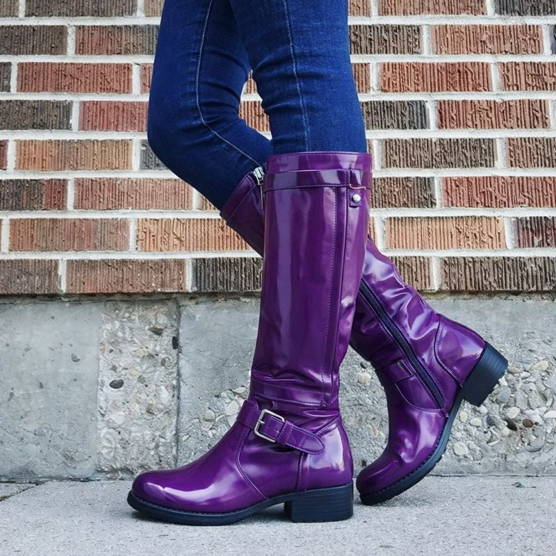 Black round toe knee-high boots with sleek leg-lengthening silhouette for effortless everyday elegance