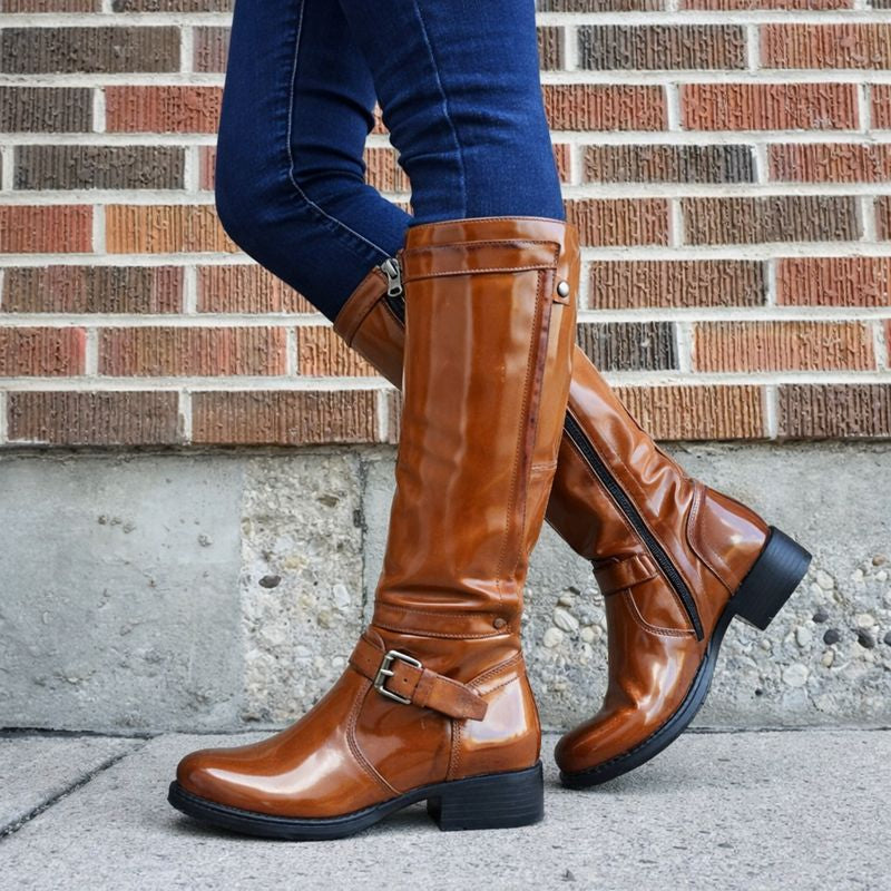 Black round toe knee-high boots with sleek leg-lengthening silhouette for everyday elegance