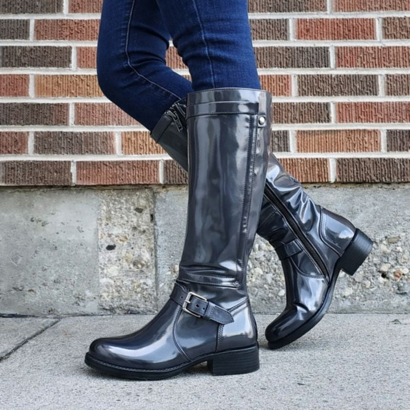 Black round toe knee-high boots with sleek leg-lengthening silhouette for effortless classic style