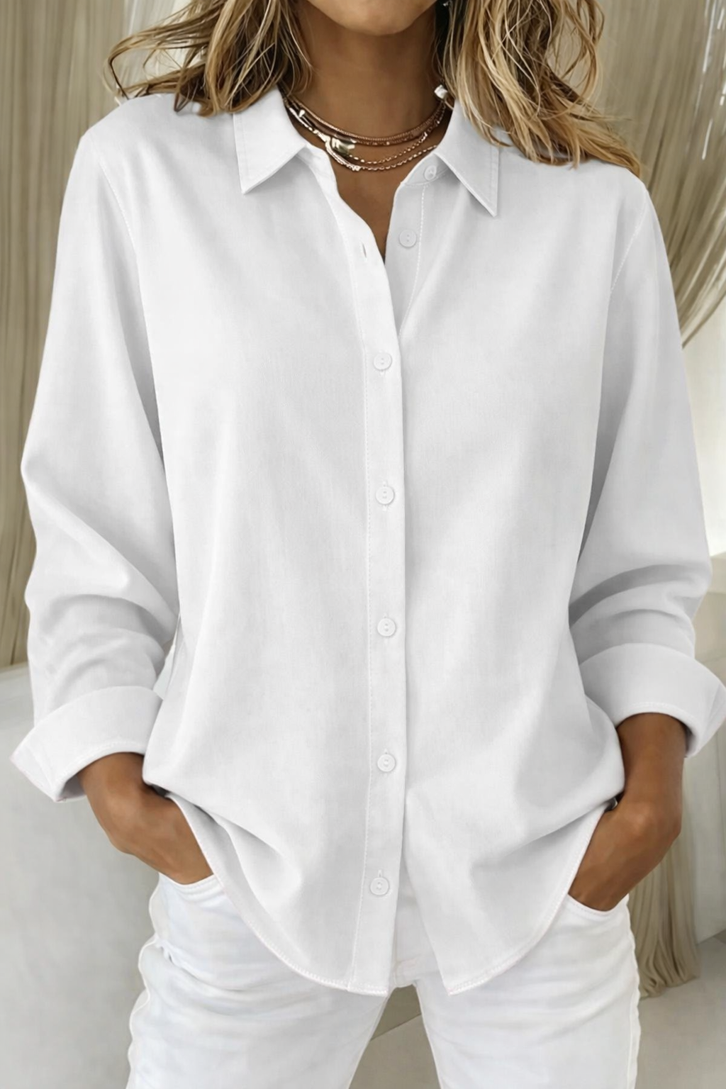Elegant white button-down blouse with structured collar and classic buttons, lightweight refined fit