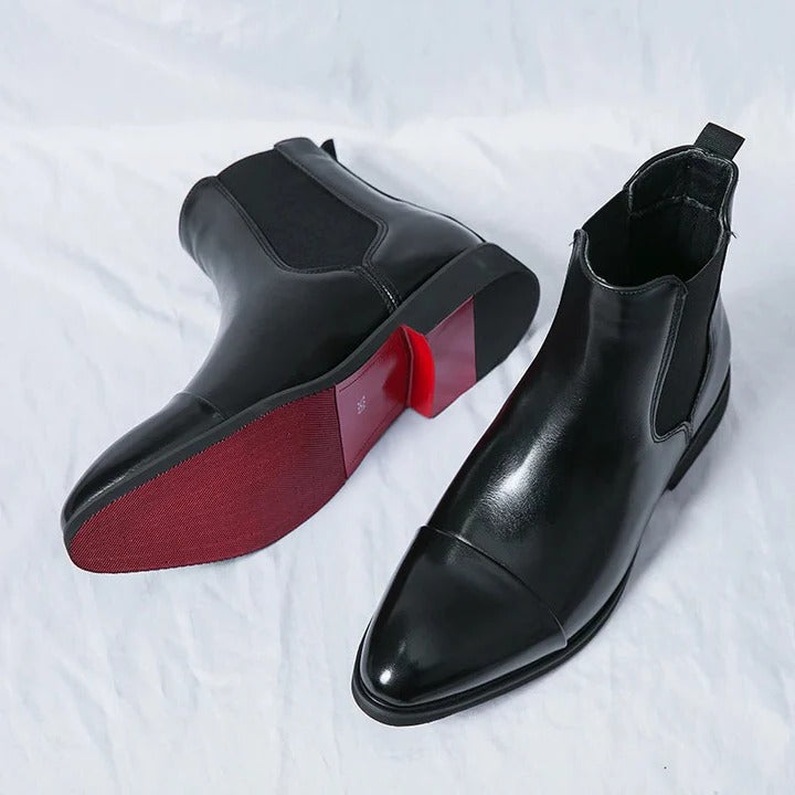 Men's black Chelsea boots with elastic side panels and sleek pull-on silhouette for everyday wear