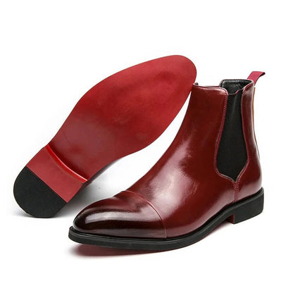 Men's black Chelsea boots with elastic side panels and pull-on design, sleek timeless silhouette