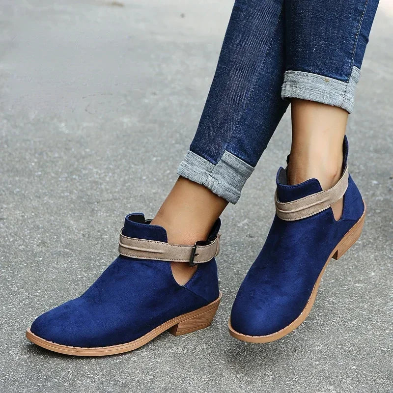 Women's black chic ankle boots with adjustable buckle strap, elegant silhouette for versatile wear