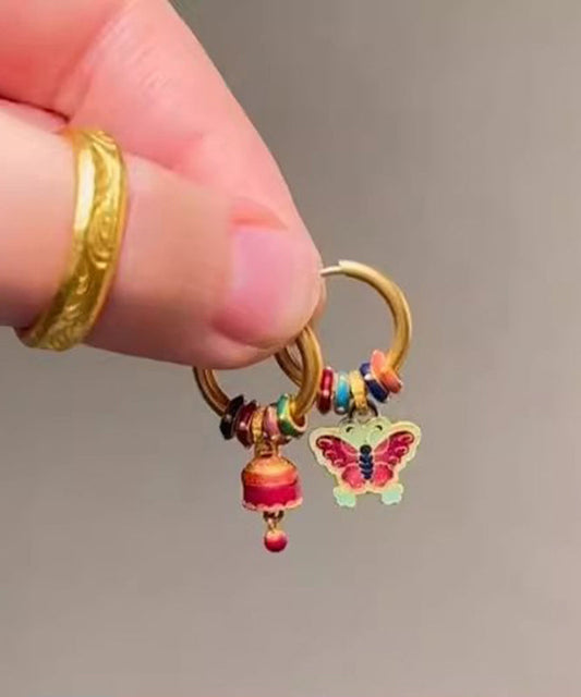 Boucles d'oreilles pendantes asymétriques en forme de cloche papillon en or antique chic - Wavlynn