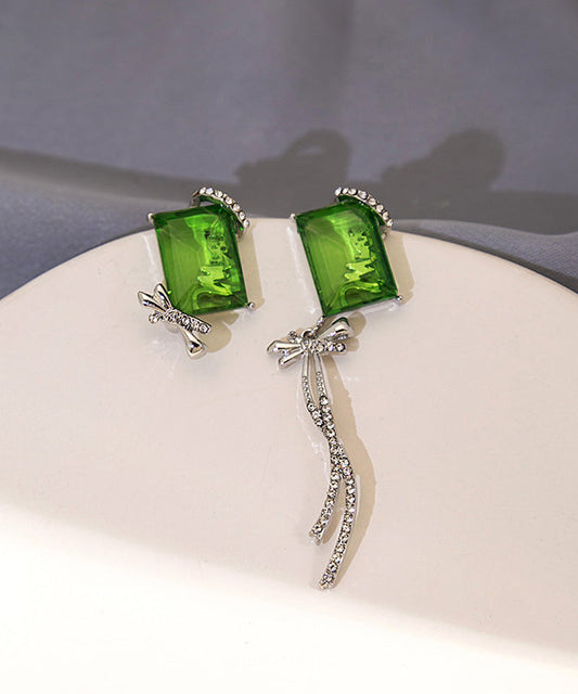 Boucles d'oreilles pendantes chics asymétriques en cuivre vert et zircon, avec nœud papillon et pompon - Wavlynn