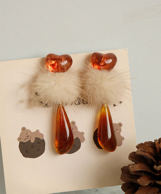 Boucles d'oreilles pendantes chics en résine plastique orange avec boules pelucheuses décorées - Wavlynn