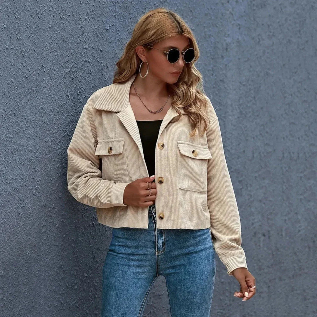Cropped corduroy jacket in neutral tone with collared neckline and oversized vintage-inspired silhouette