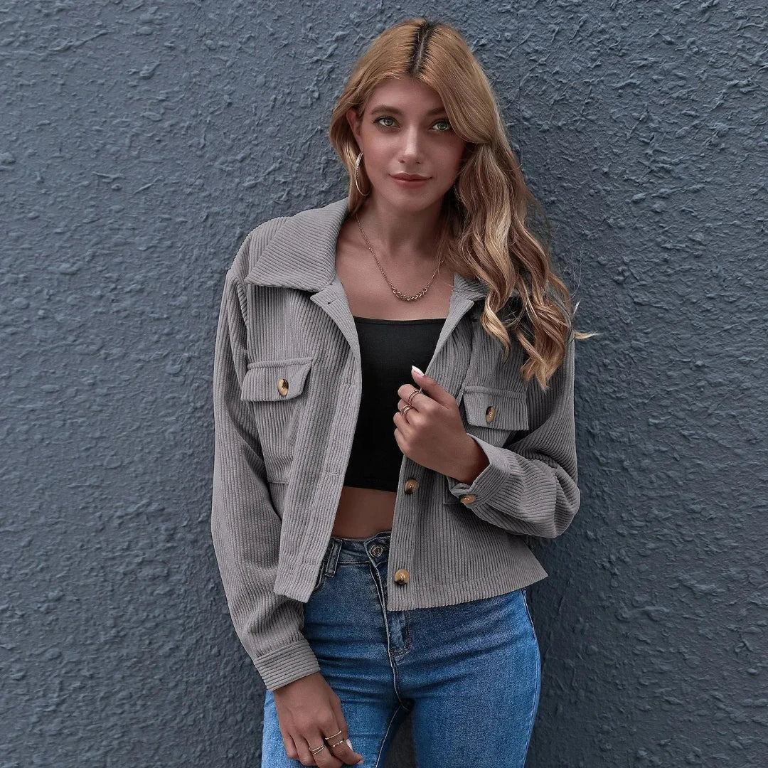 Cropped corduroy jacket in neutral tone with collared neckline and relaxed oversized vintage-inspired silhouette