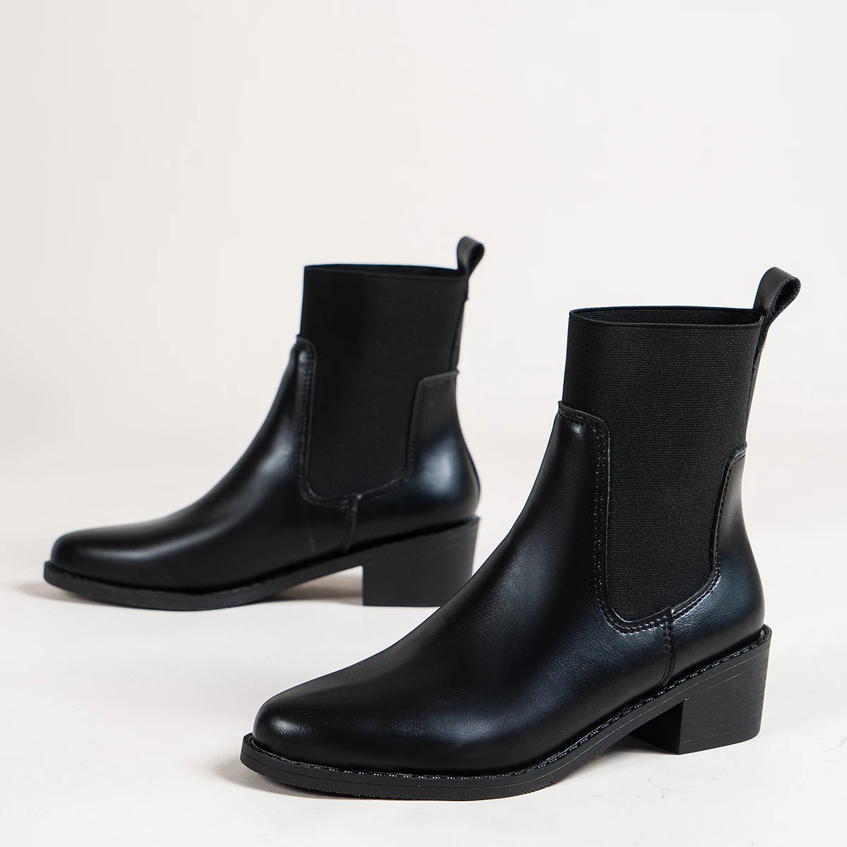 Women's black chunky heel Chelsea boots with pointed toe and sewn thread detailing