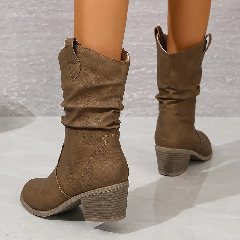 Women's brown chunky block heel western boots with slip-on design and retro rugged silhouette