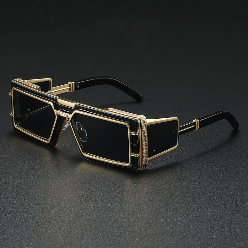 Bold black square fortress-design sunglasses with punk-luxury aesthetic and thick angular frames