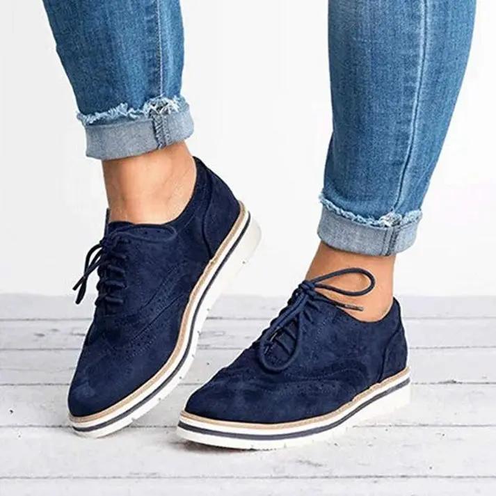 Women's classic brogue trainers in neutral tones, wingtip silhouette with decorative perforations
