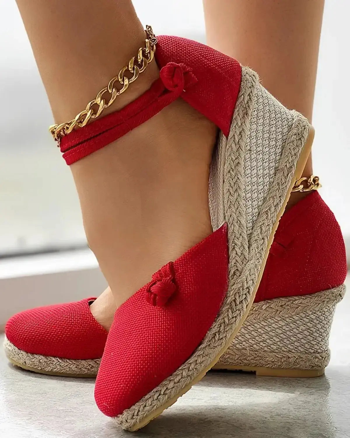 Women's closed-toe wedge espadrilles in neutral tone with braided jute sole and adjustable strap