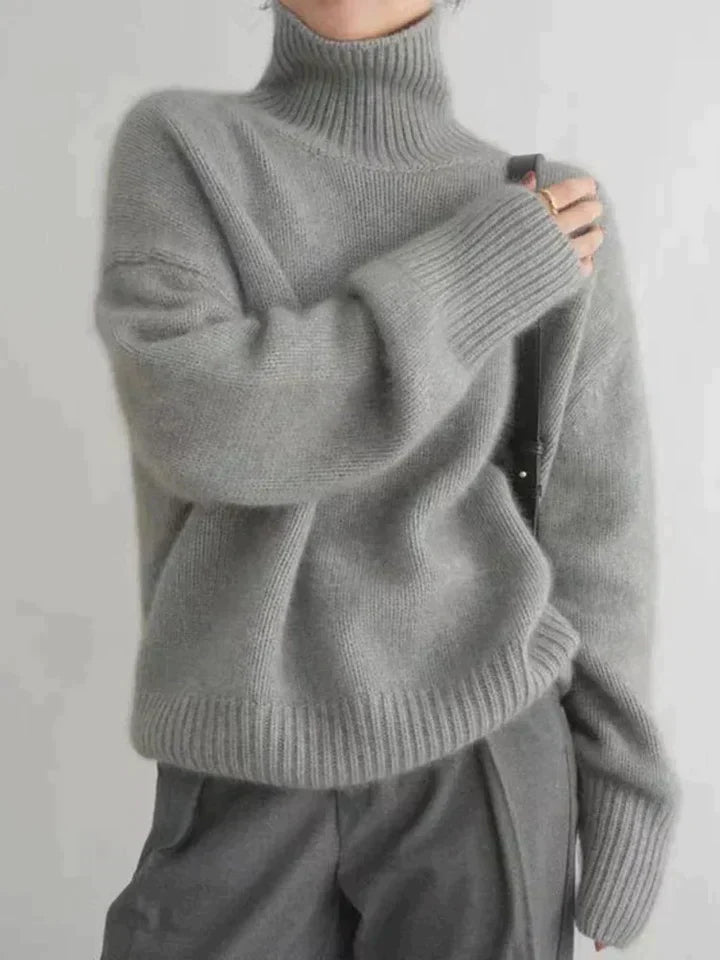 Women's oversized wool turtleneck sweater cozy knit dropped shoulders ribbed hem winter style