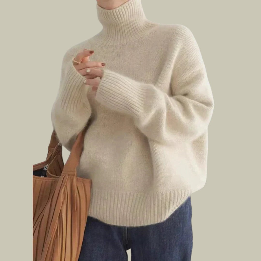 Women's ivory merino wool high neck relaxed fit sweater with elegant drape and cozy sophisticated style