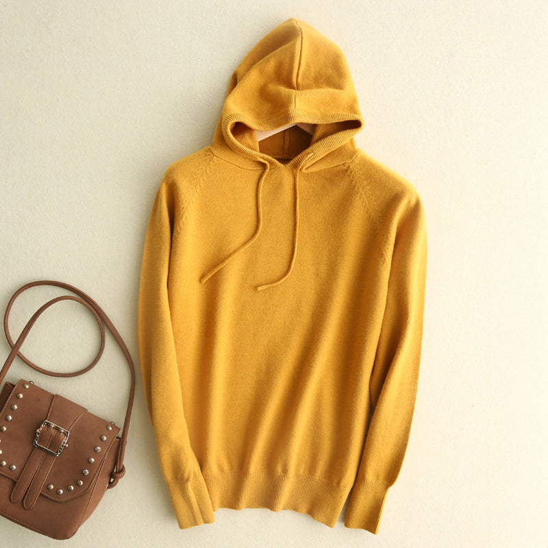 Cream lightweight fine-knit hoodie with minimalist silhouette, subtle drawstrings, and relaxed fluid drape
