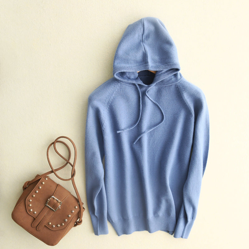 Beige lightweight fine-knit hoodie with minimalist silhouette, subtle drawstrings, and relaxed fluid drape