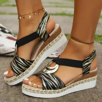Cressida open-toe wedge sandals with woven jute platform, metallic crescent hardware, elastic slingback straps