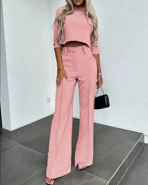 Women's black cropped top and high-rise trousers co-ord set with flattering waist-defining silhouette
