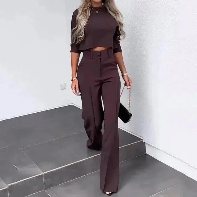 Women's black cropped top and high-rise trousers co-ord set with flattering waist-defining silhouette