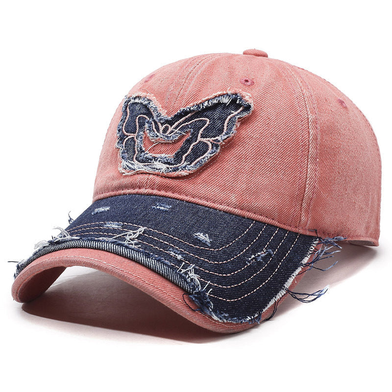 Washed denim baseball cap with embroidered butterfly accent, retro curved brim streetwear style