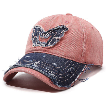 Washed denim baseball cap with embroidered butterfly accent, retro curved brim streetwear style