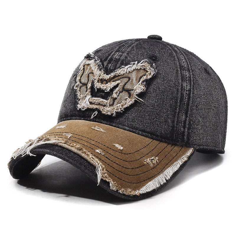Washed denim baseball cap with embroidered butterfly accent, curved brim, retro streetwear style