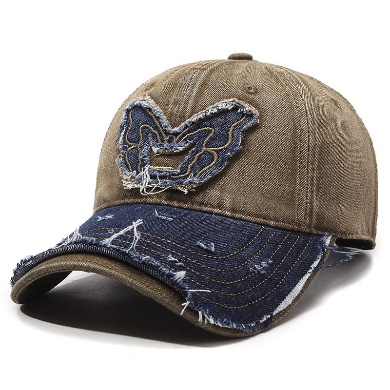 Washed denim baseball cap with embroidered butterfly accent, curved brim, retro streetwear style