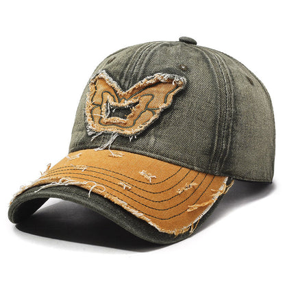 Washed denim baseball cap with embroidered butterfly accent, retro curved brim streetwear style
