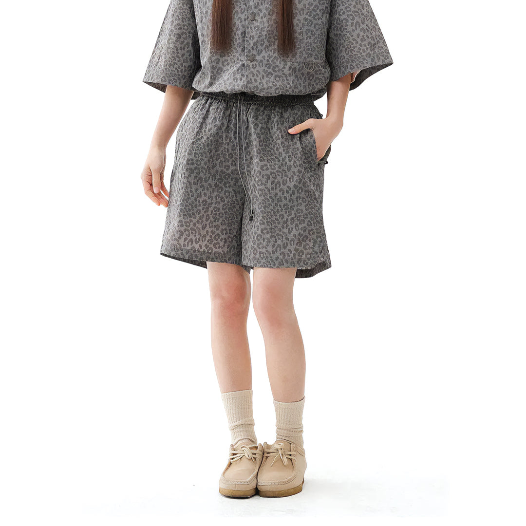Leopard print quick-dry nylon shorts with elastic drawstring waist, relaxed knee-length fit