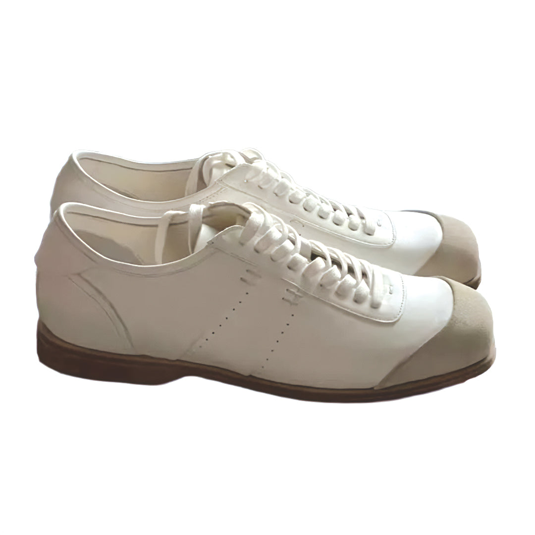 White low-top vegan leather court sneaker with subtle stitchwork and minimal street style design