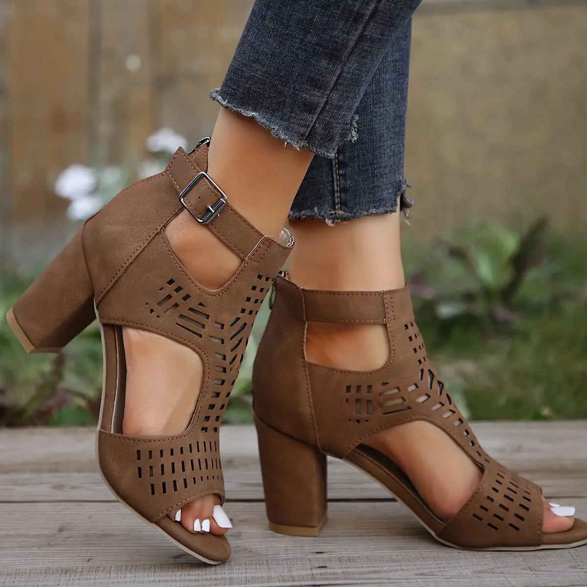 Black cut-out peep-toe ankle boots for women with edgy lattice pattern and bold contemporary style