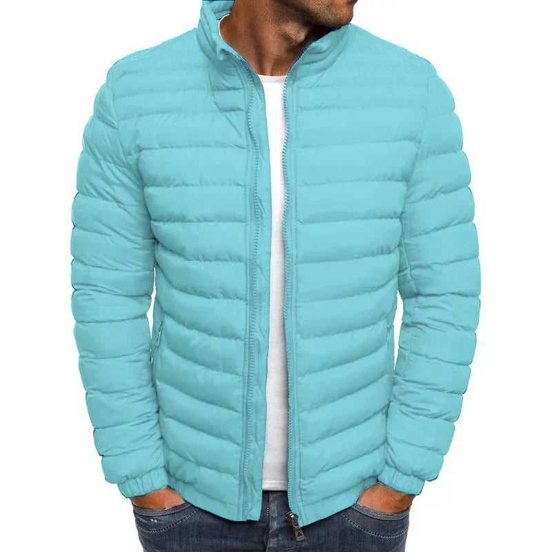 Men's lightweight navy puffer jacket with high collar, zip closure, and windproof quilted design