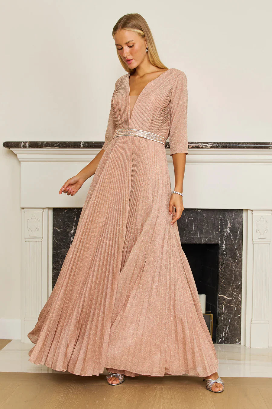 Black long sleeve formal evening dress with V-neckline, 3/4 sleeves, and flowing layered A-line skirt