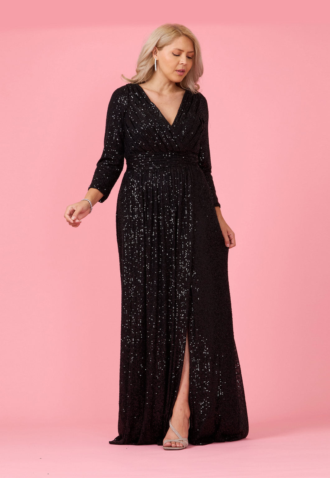 Floor-length long sleeve sequin prom dress with deep V-neckline and hand beaded embellishments