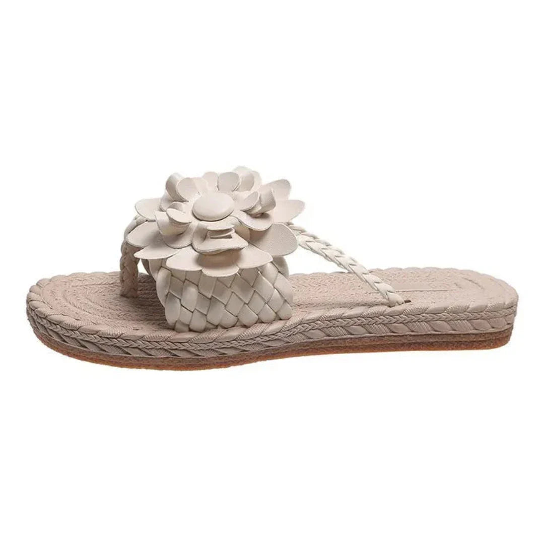 Women's floral woven slip-on flat sandals with bold 3D flower embellishments and braided strap