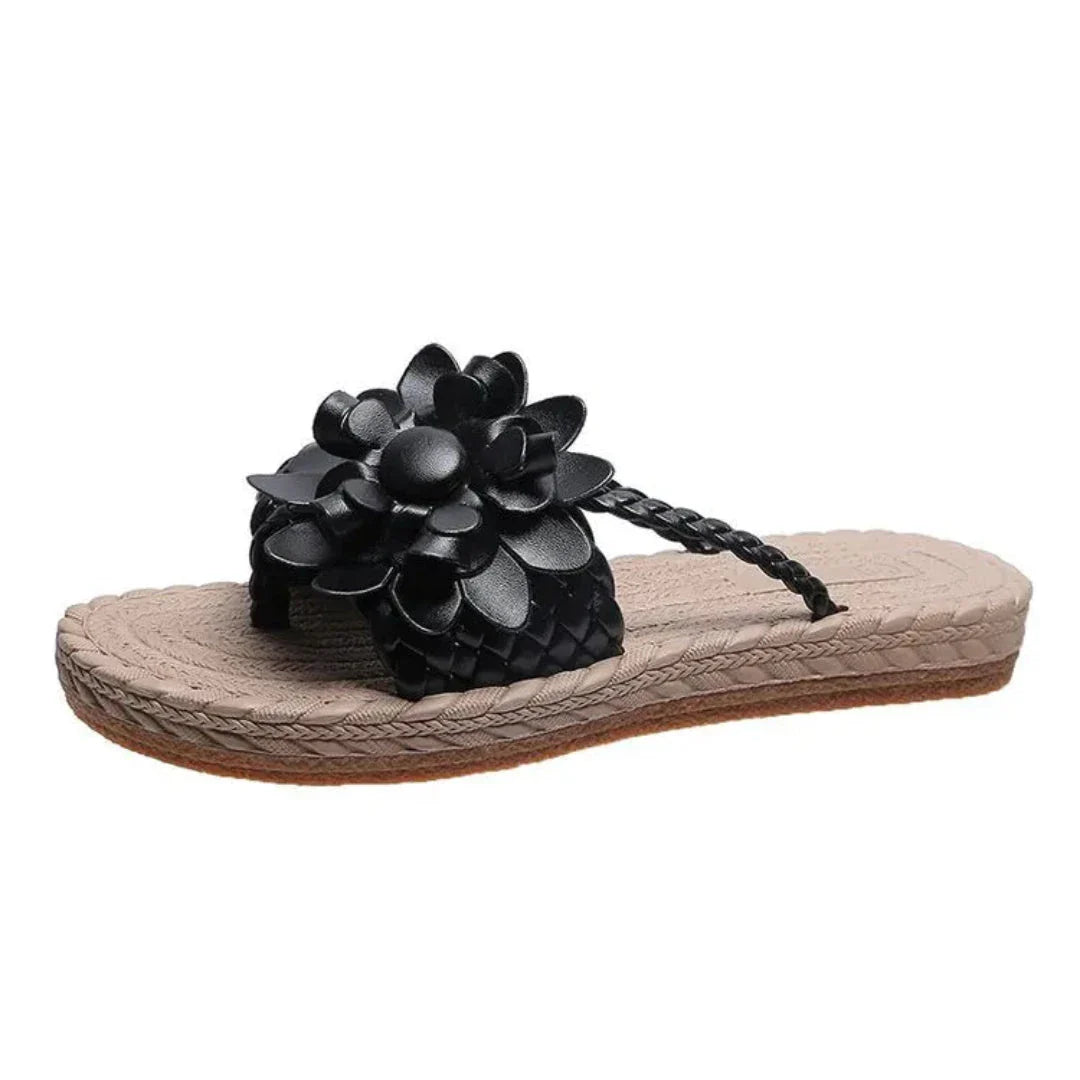 Women's floral woven slip-on sandals with bold 3D flower embellishments and braided strap flat sole