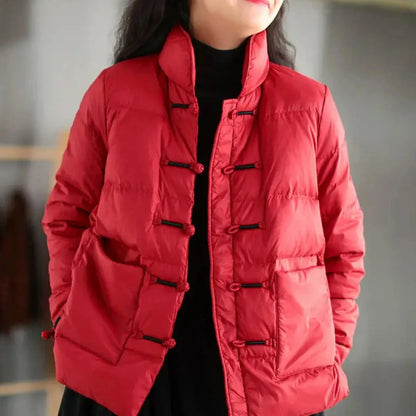 Navy blue knotted down jacket with mandarin collar, toggle closures, and oversized patch pockets